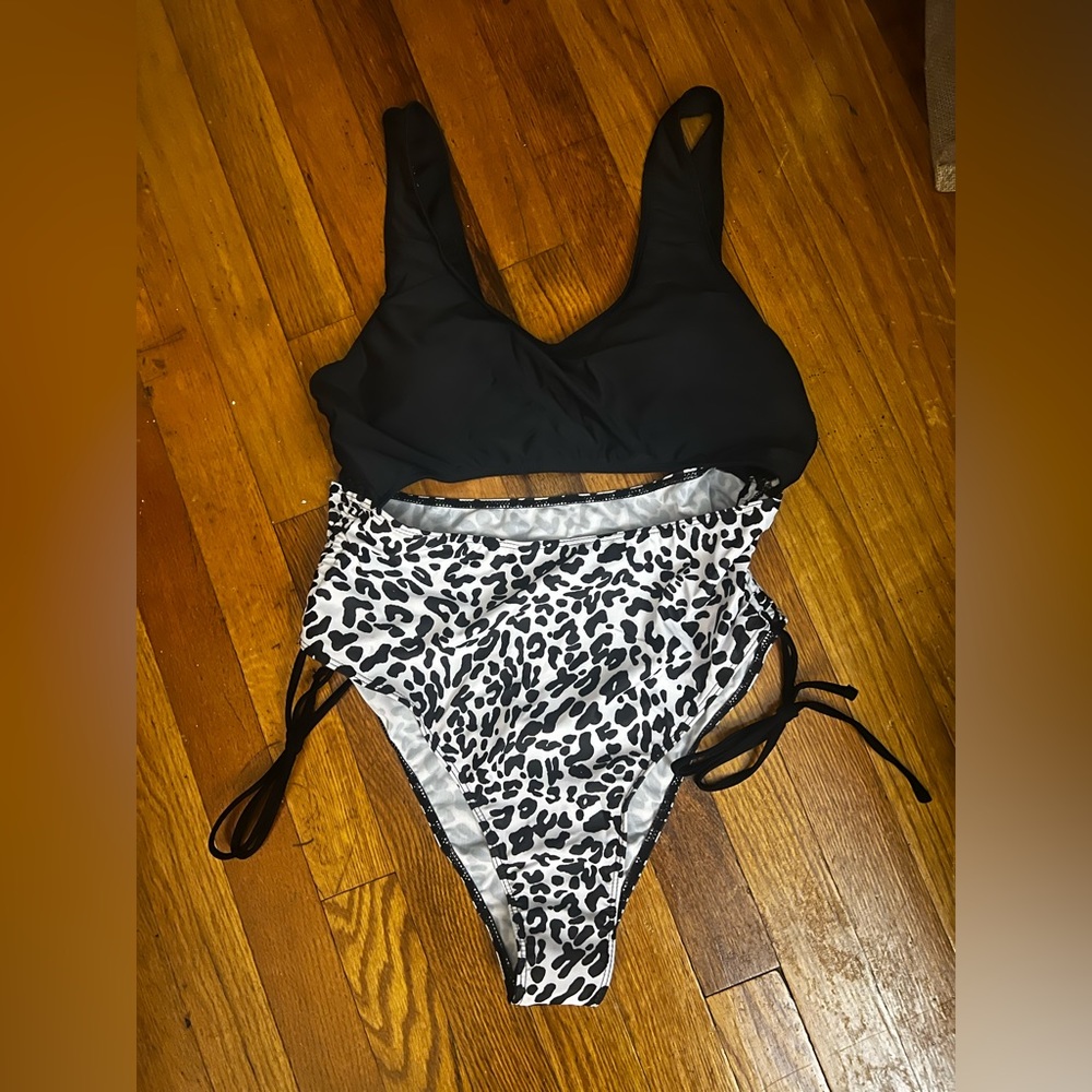 One piece draw string bathing suit.